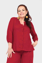 Dark red button-front blouse top with three-quarter sleeves and collar