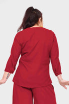 Dark red button-back blouse top with three-quarter sleeves