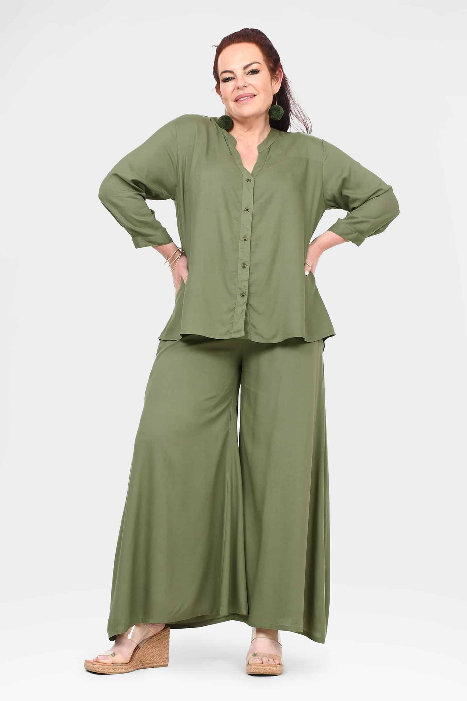 Green wide-leg pants with soft fall and long, skirt-like wide hems