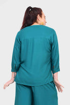 Back view of teal blouse top with button placket and three-quarter sleeves
