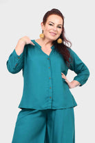 Teal blouse top with button front, three-quarter sleeves, and stand collar