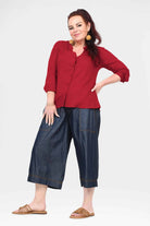 Blue denim 3/4 wide-leg pants with belt loops and side pockets
