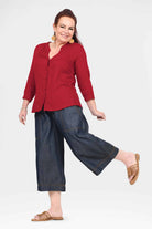 Blue denim 3/4 wide-leg pants with front slant pockets and relaxed fit