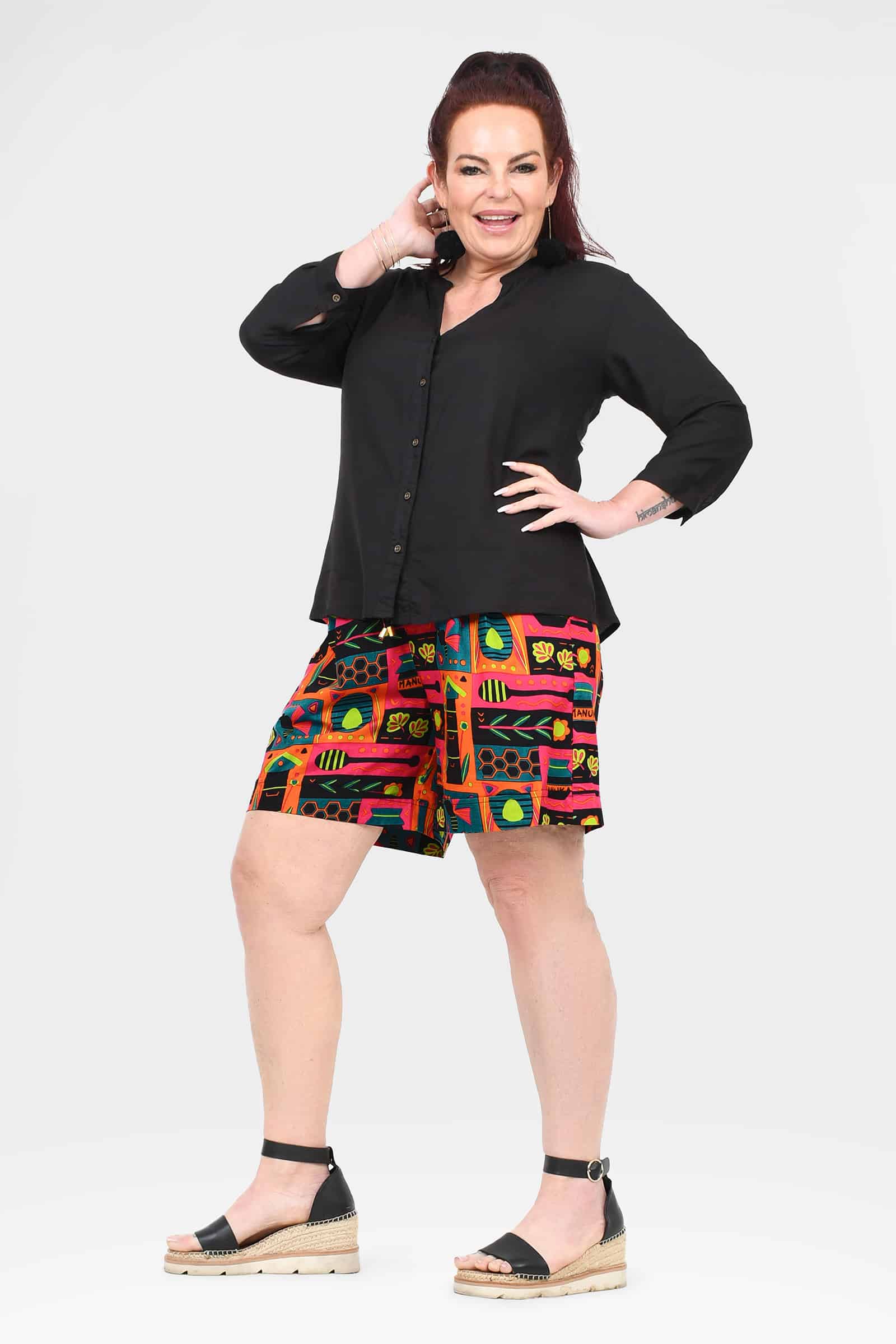 Bee-themed block print shorts, above-knee, front view