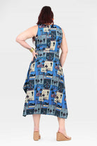 Capri dress sleeveless back view, blue-and-cream cartoon patchwork print, midi flare