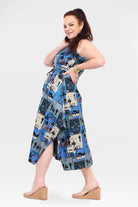 Capri dress sleeveless side view, blue-and-cream cartoon patchwork print, side slit