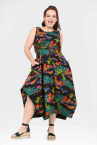 Sleeveless capri dress, vibrant tropical print, high-low hem and side pockets
