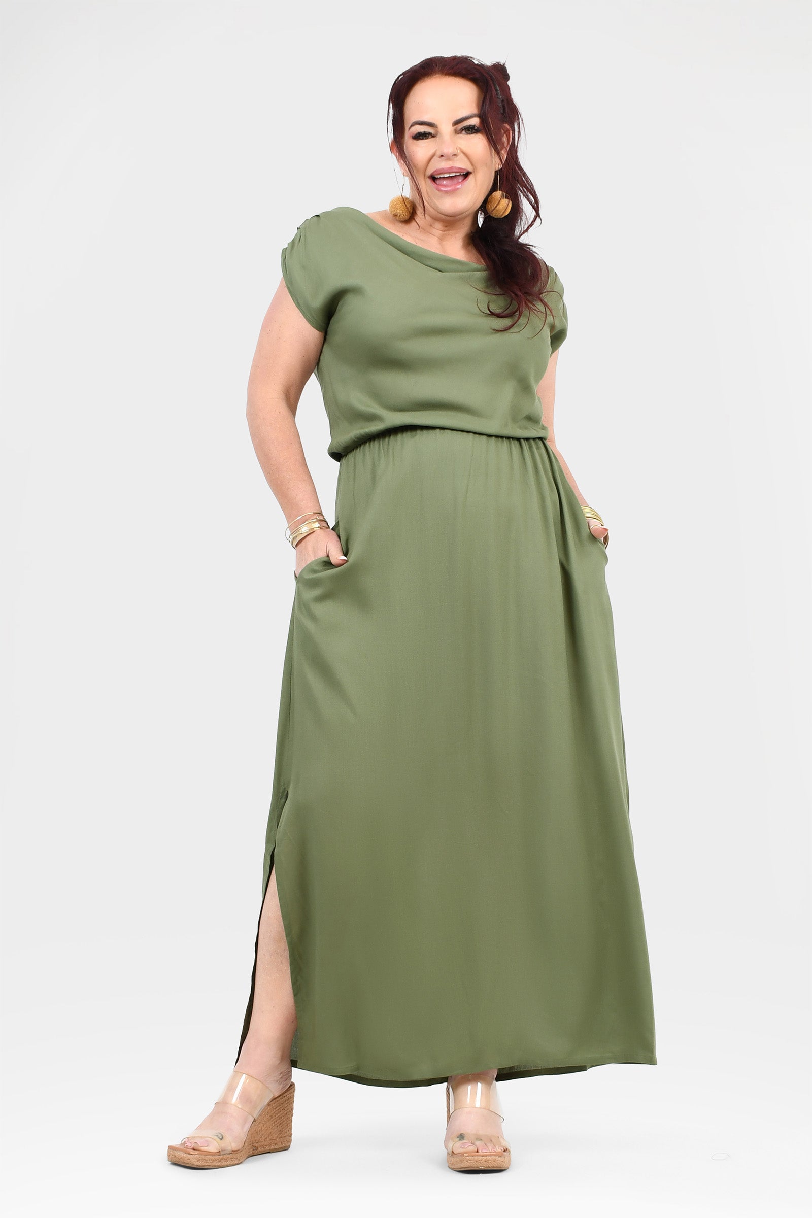 Olive green maxi dress with short sleeves, gathered waist, and side slit