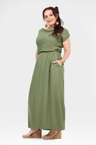 Olive green maxi dress with short sleeves and gathered waist, flowing skirt