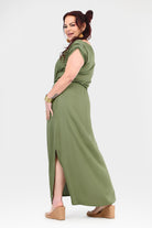 Olive green maxi dress with short sleeves, gathered waist, and leg slit