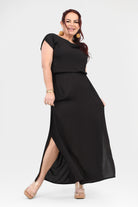 Black maxi dress with draped cowl neckline, short sleeves, and long flowing skirt