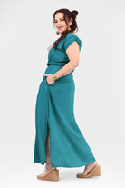 Teal side-view maxi dress with cap sleeves, gathered waist, and side slit