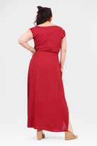 Dark red maxi dress with cap sleeves and gathered waist; back view