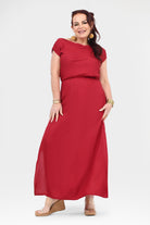 Dark red maxi dress with cap sleeves and elastic waist band; front view