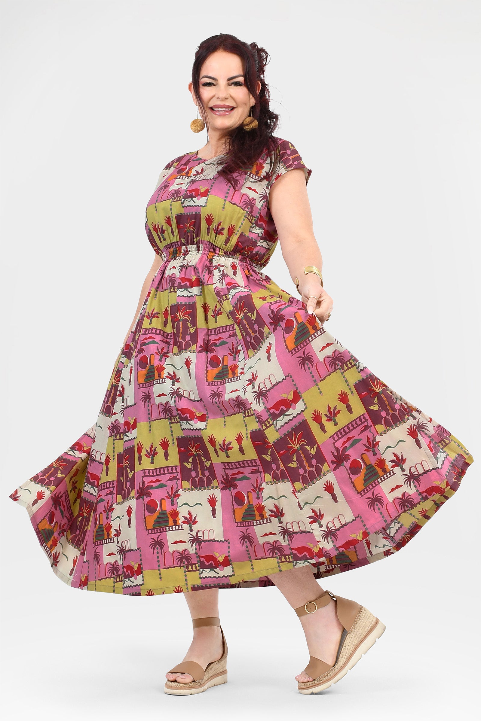 Pink long dress with colorful animal and cactus print, tiered flared skirt
