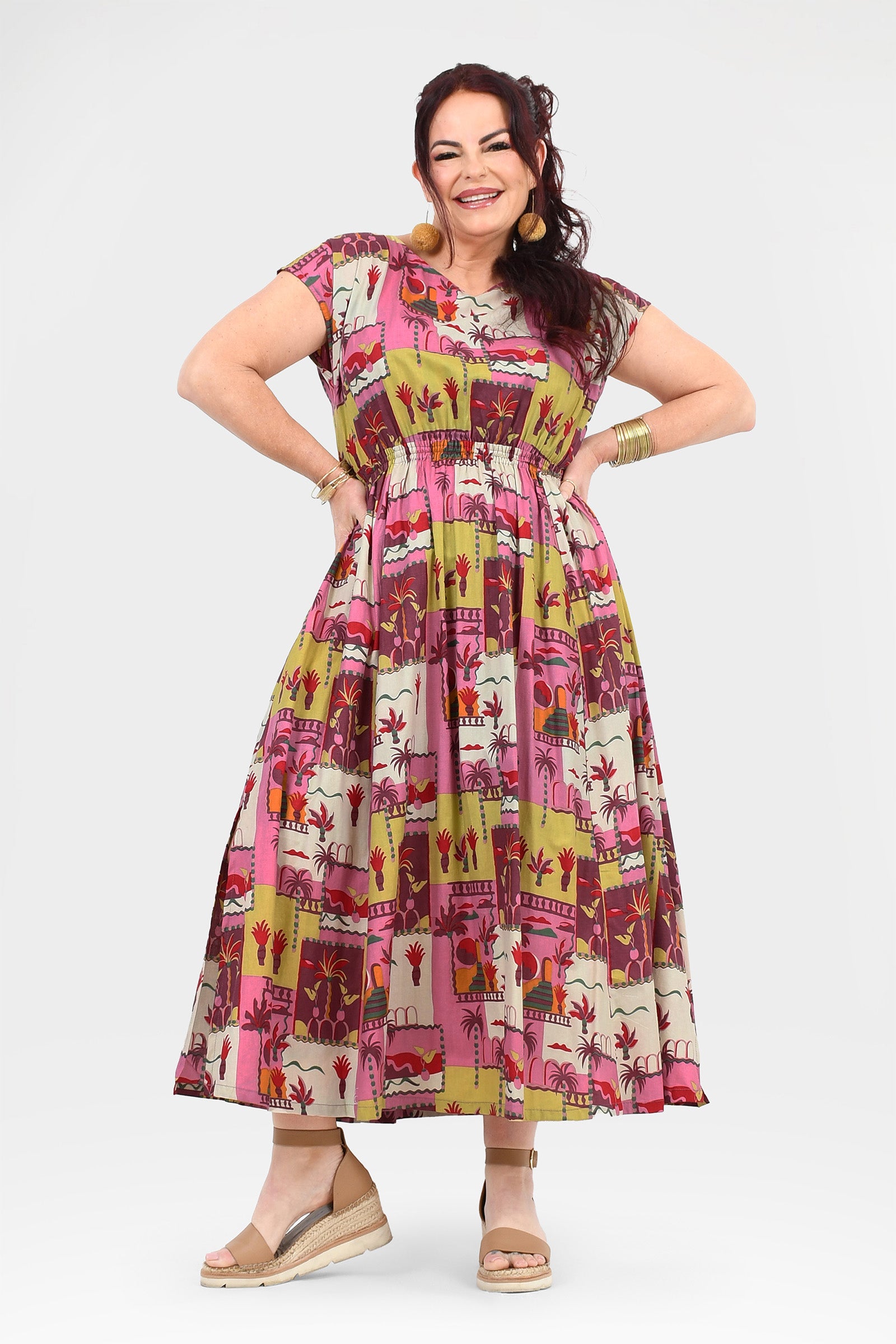 Pink long dress with colorful animal-and-cactus print, round neckline, midi-to-maxi length