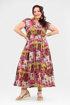 Pink long dress with colorful animal-and-cactus print, round neckline, midi-to-maxi length