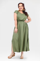 Olive green long maxi dress with gathered waist, short sleeves, and front slit