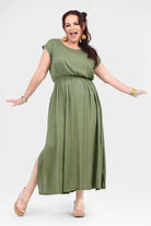 Olive green maxi dress with ruched waist and short sleeves, side slit at hem