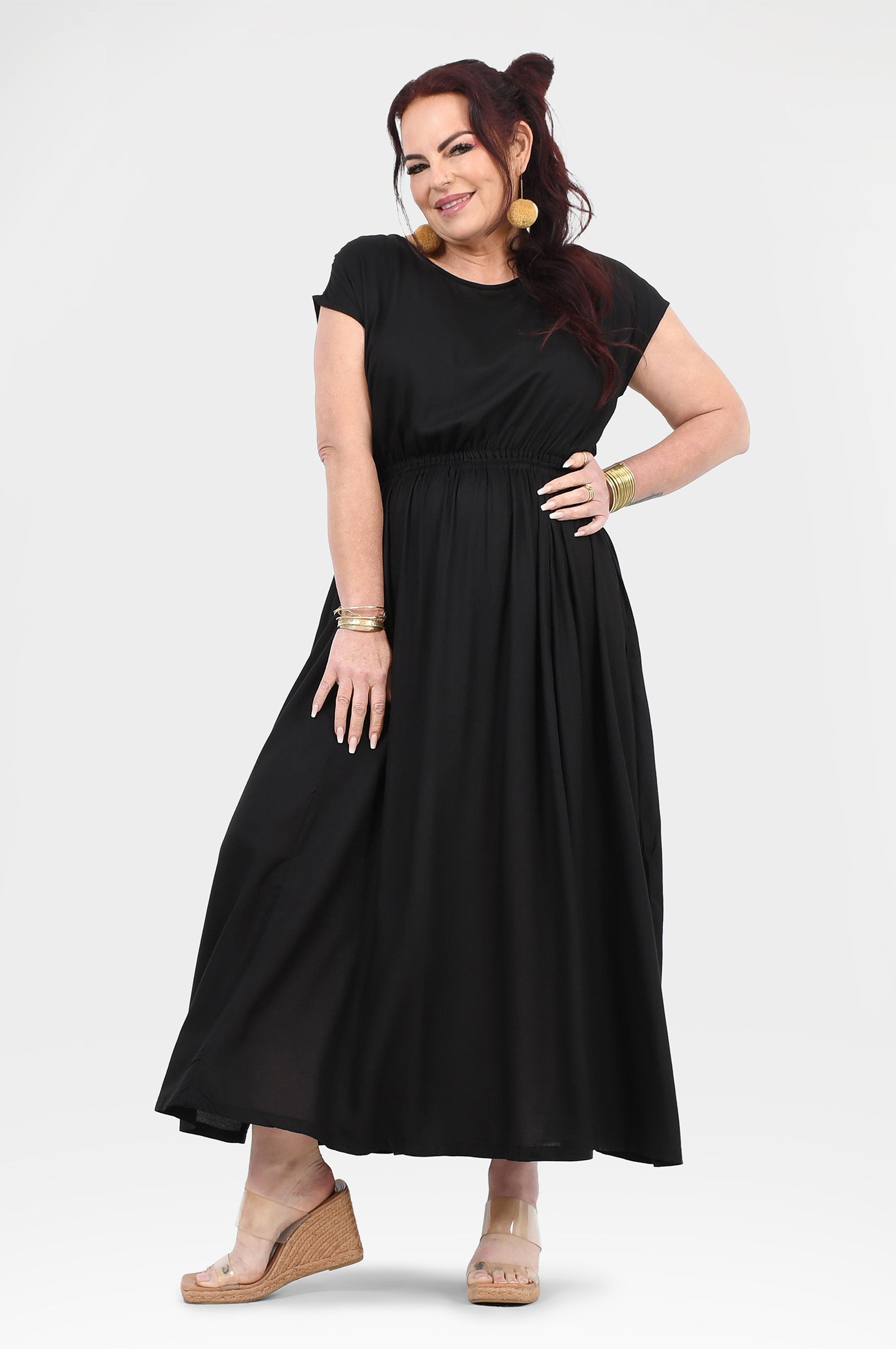 Black long dress with short sleeves, round neck, gathered waist, and full skirt