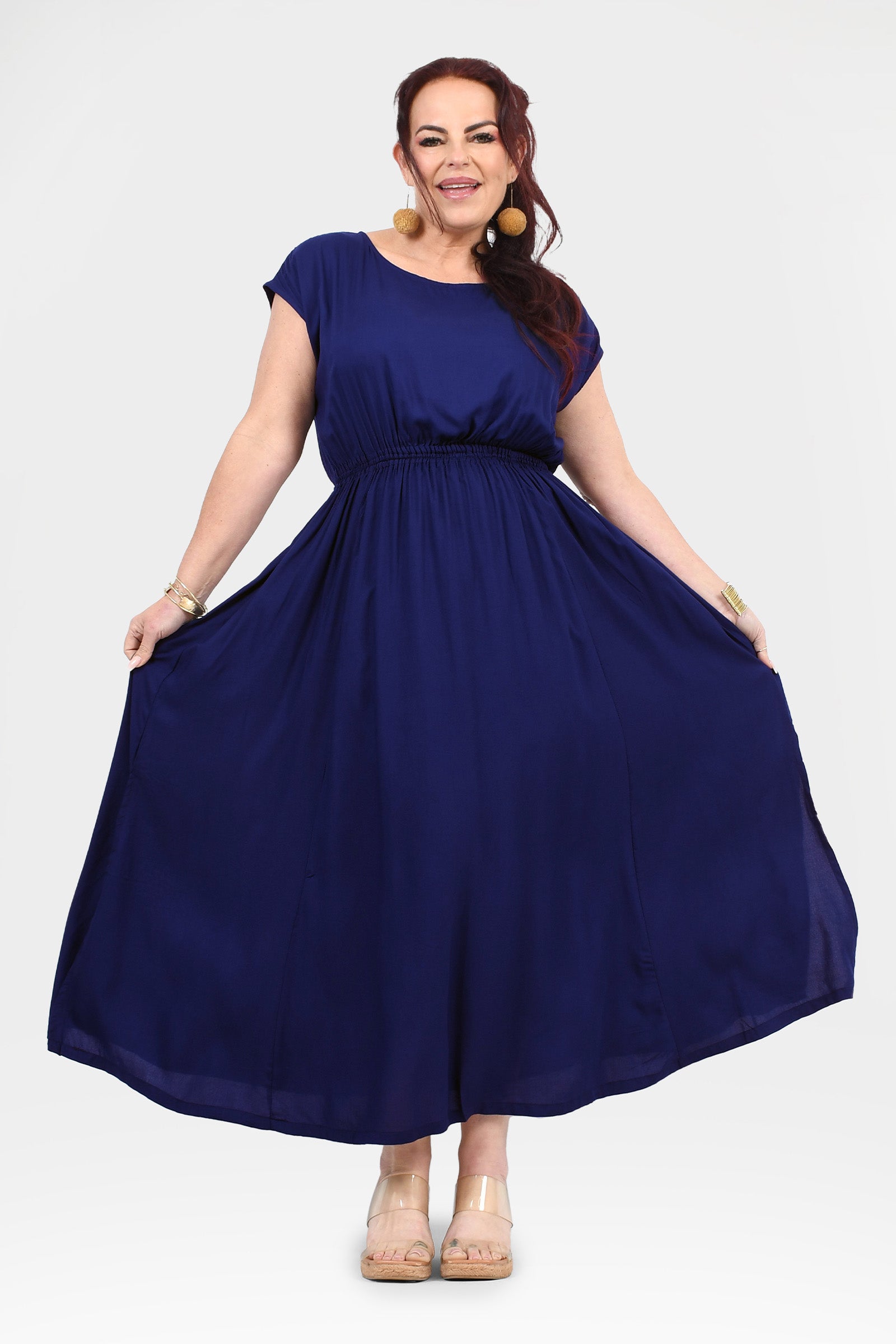 Dark blue long dress with gathered waist, short sleeves, and wide flared hem