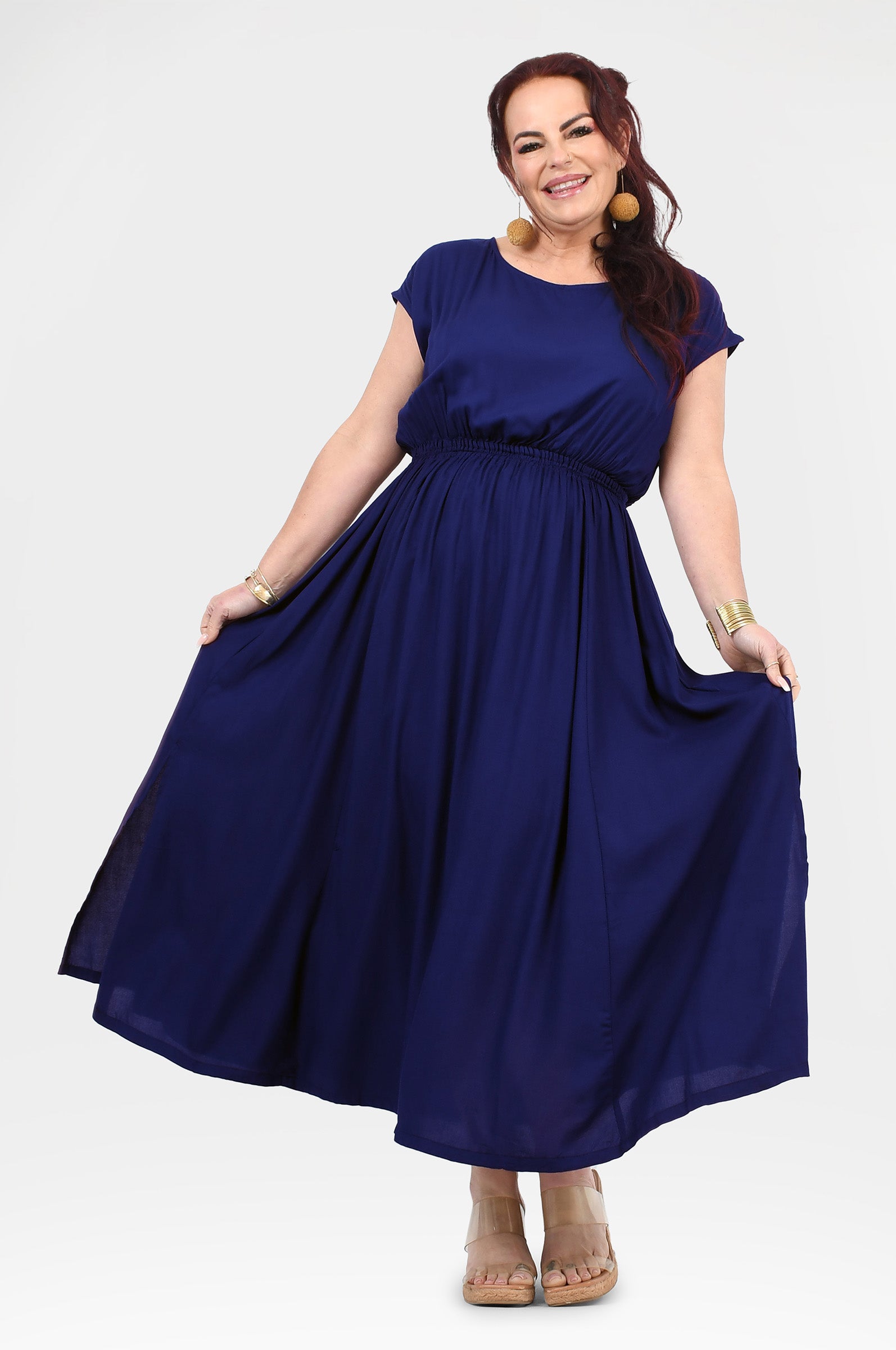 Dark blue long dress with gathered waist, short sleeves, and flowing A-line skirt