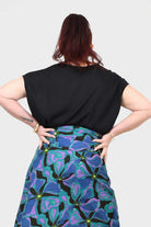 Black short-sleeve top with relaxed fit, crew neckline, open back view.