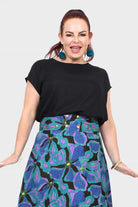 Black crew-neck short-sleeve top with relaxed, draped fit.