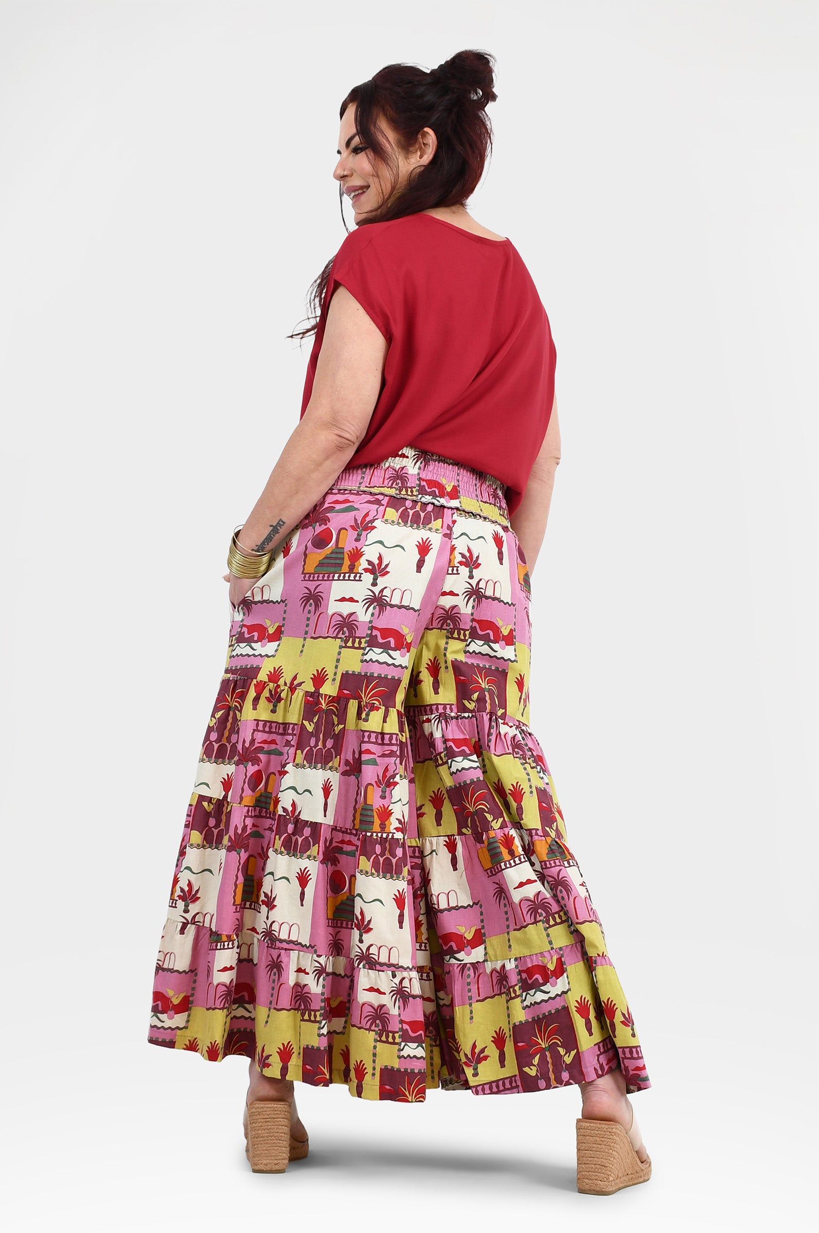 Havana pants back view: pink tiered midi skirt with yellow-lined animal print
