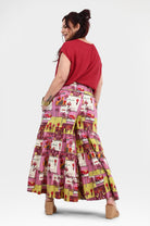Havana pants back view: pink tiered midi skirt with yellow-lined animal print