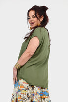 Pistachio green sleeveless-look Nora top with short sleeves and crew neckline