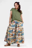 Wide-leg printed pants in white, blue, and orange with elastic waist and gathered drape