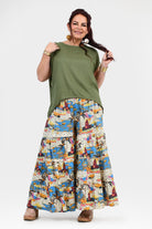 White-based wide-leg pants with blue and orange jungle print, full gathered silhouette