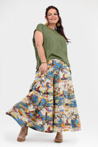 Printed wide-leg pants with elastic waistband; white, blue, and orange tropical artwork