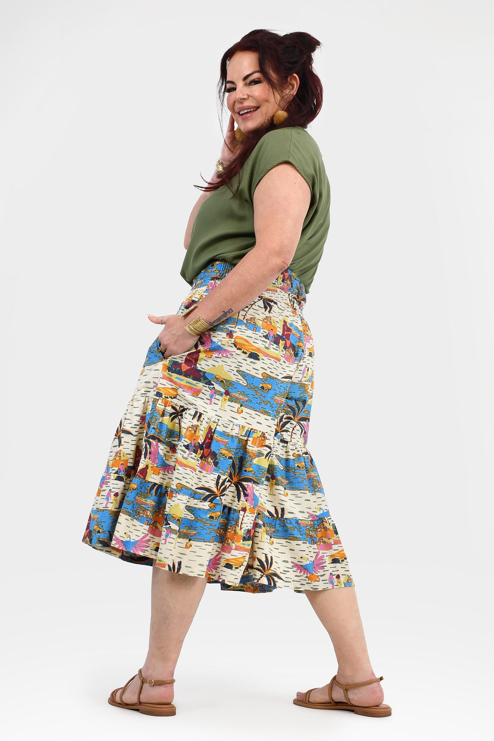 3/4 length skirt pants in blue, orange, and white tropical print with elastic waist