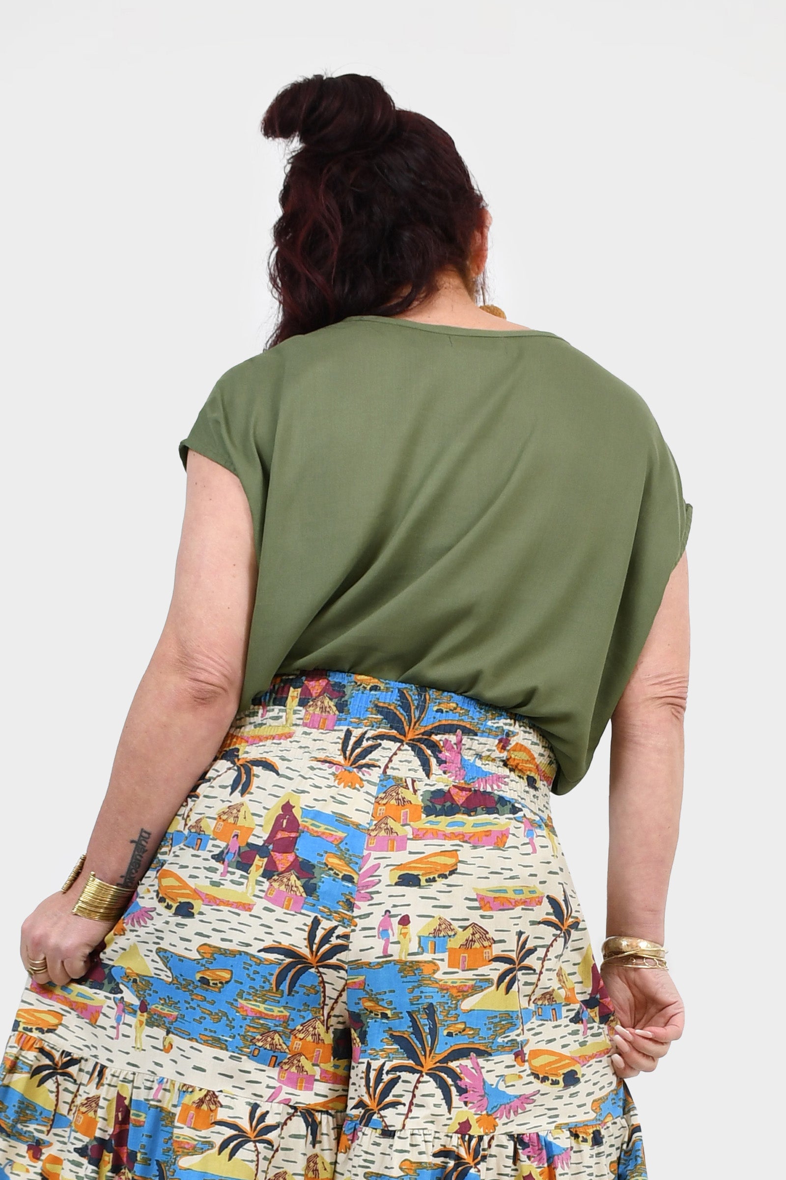 Back view of pistachio green Nora top with short sleeves and draped back