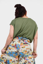 Back view of pistachio green Nora top with short sleeves and draped back
