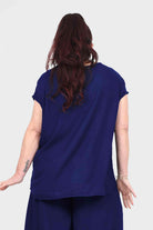 Dark blue Nora top back view with short sleeves and round neckline, relaxed fit.