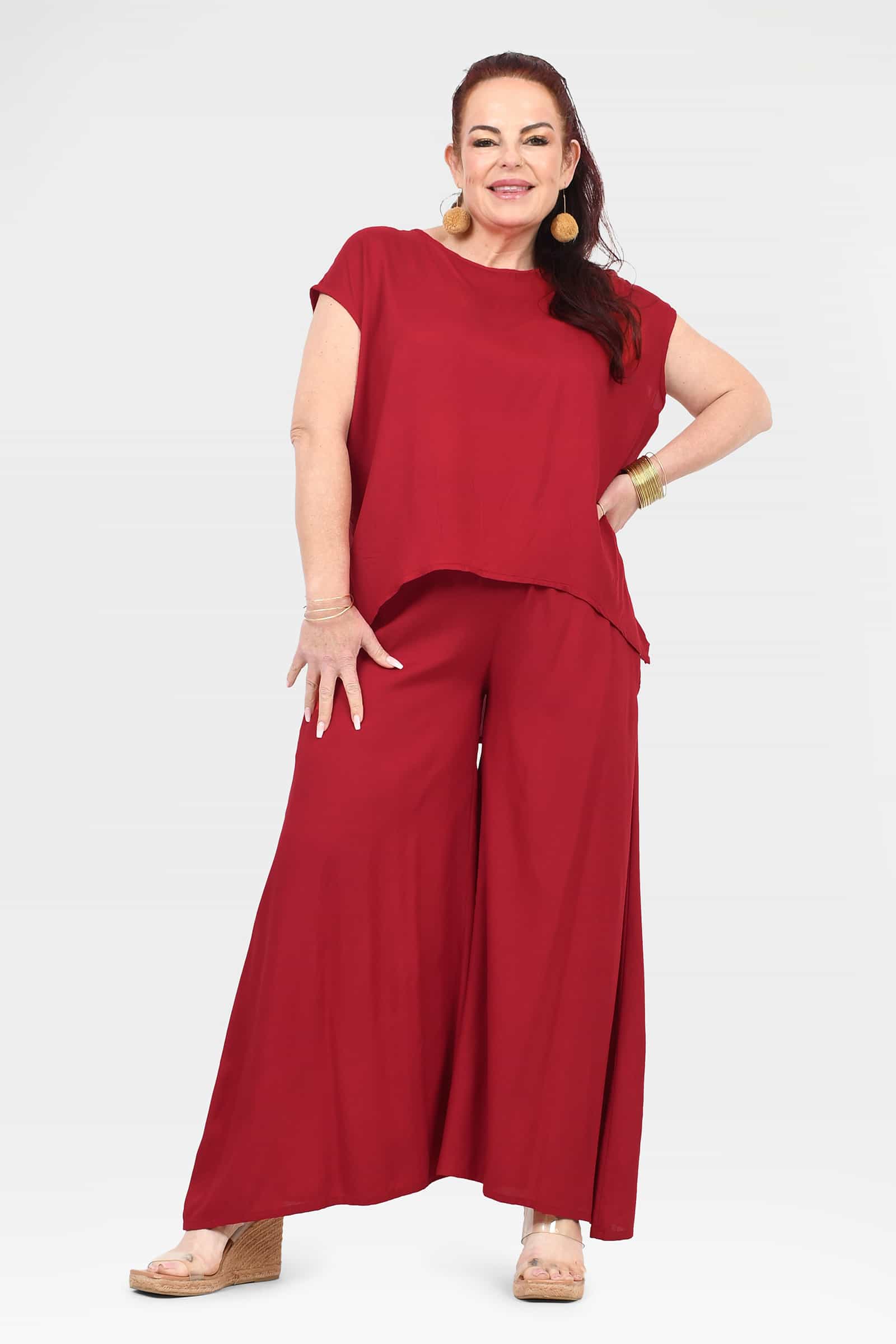Dark red wide-leg pants with elastic waist and flowing drape