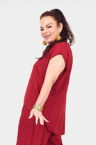 Dark red draped short-sleeve top, side view