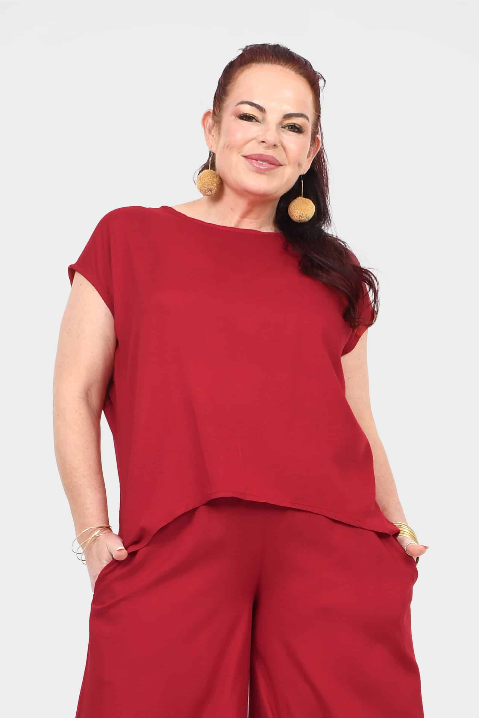 Dark red draped short-sleeve top with relaxed fit and curved hem
