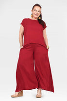 Dark red wide-leg pants with loose legs and elastic waistband