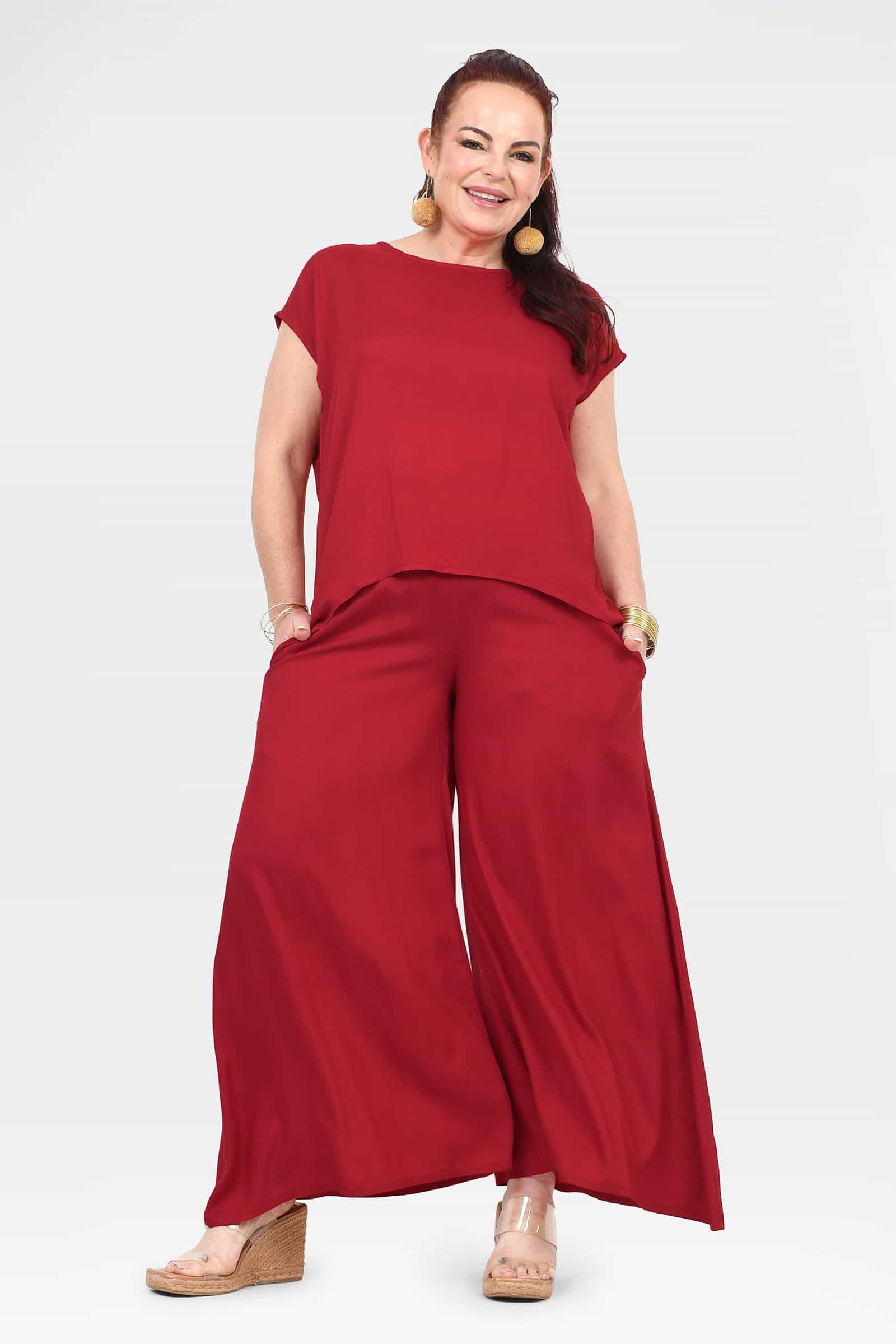 Dark red wide-leg pants with loose legs and elastic waistband