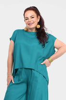 Teal short-sleeve crewneck top with layered-look hem detail, front view