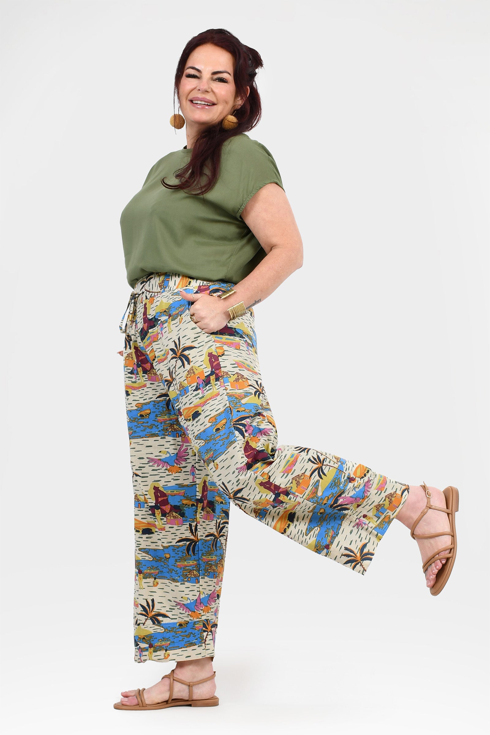 Off-white printed pants with multicolor motif, wide legs and cuffed hems