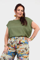 Pistachio green Nora top with crew neckline and loose fit through the torso