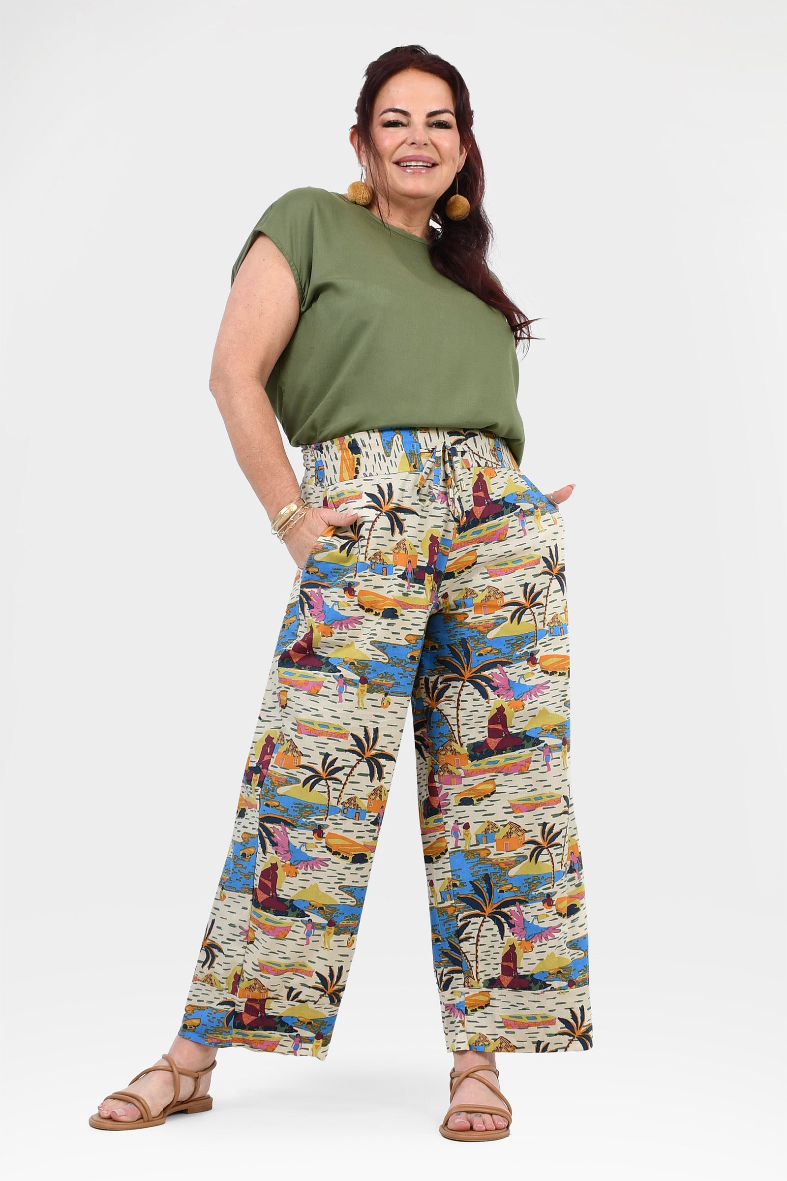 Printed wide-leg pants, off-white base with vibrant abstract jungle print