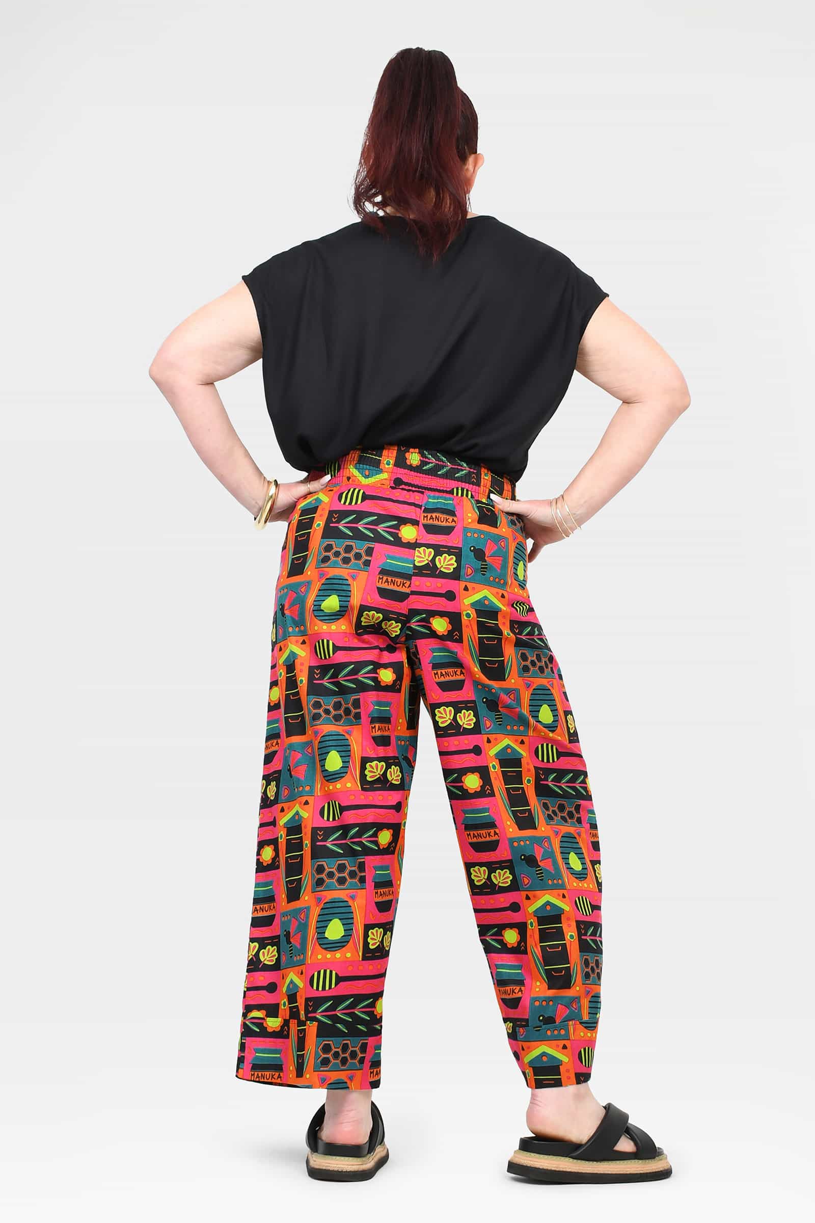 Back view of wide-leg printed pants with elastic waistband