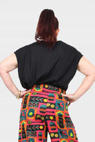 Black short-sleeve top from the back with relaxed shoulders