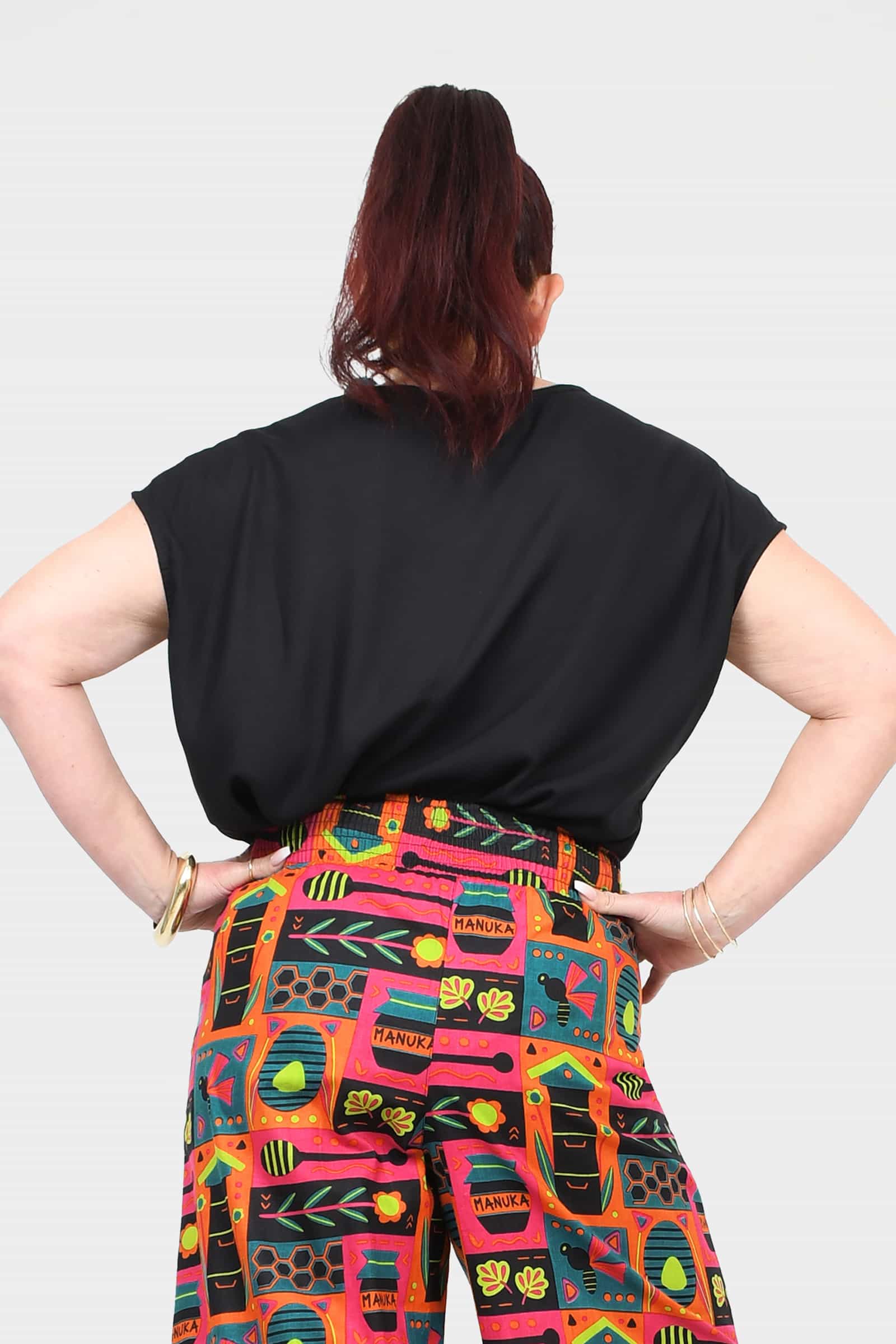 Black short-sleeve top from the back with relaxed shoulders